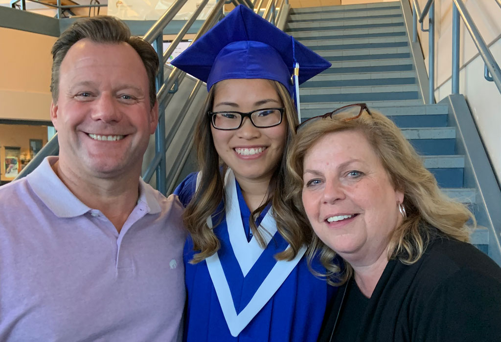 Photo of Ryan Tompkins with his daughter, Quinn, and wife, Cathy