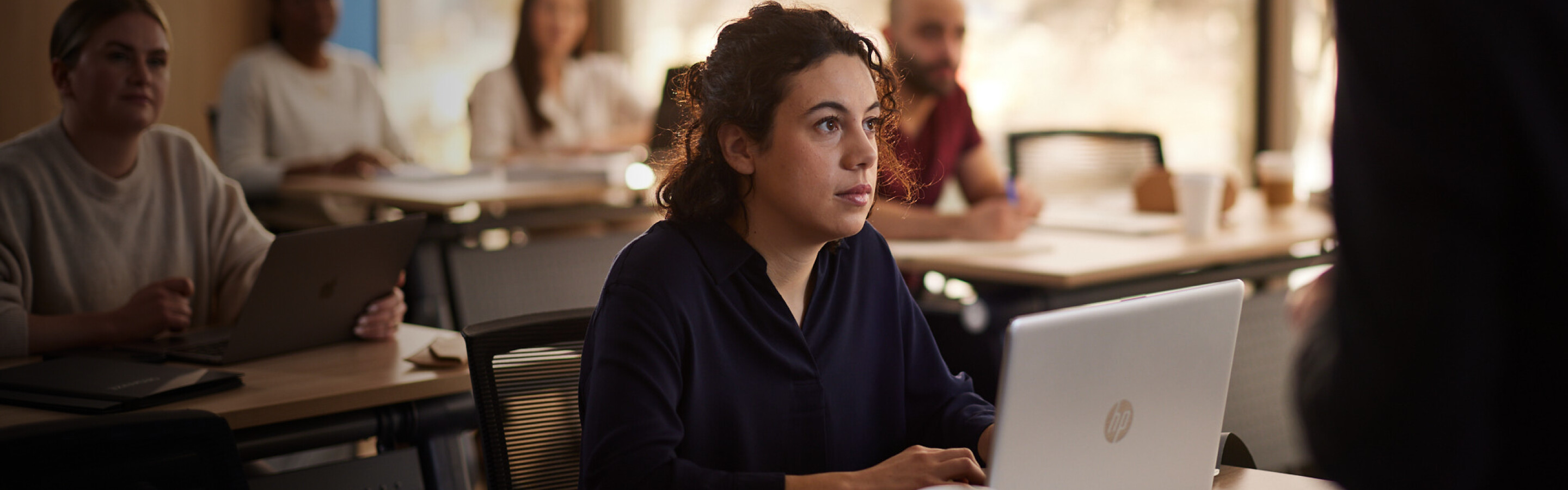 Student in classroom with laptop