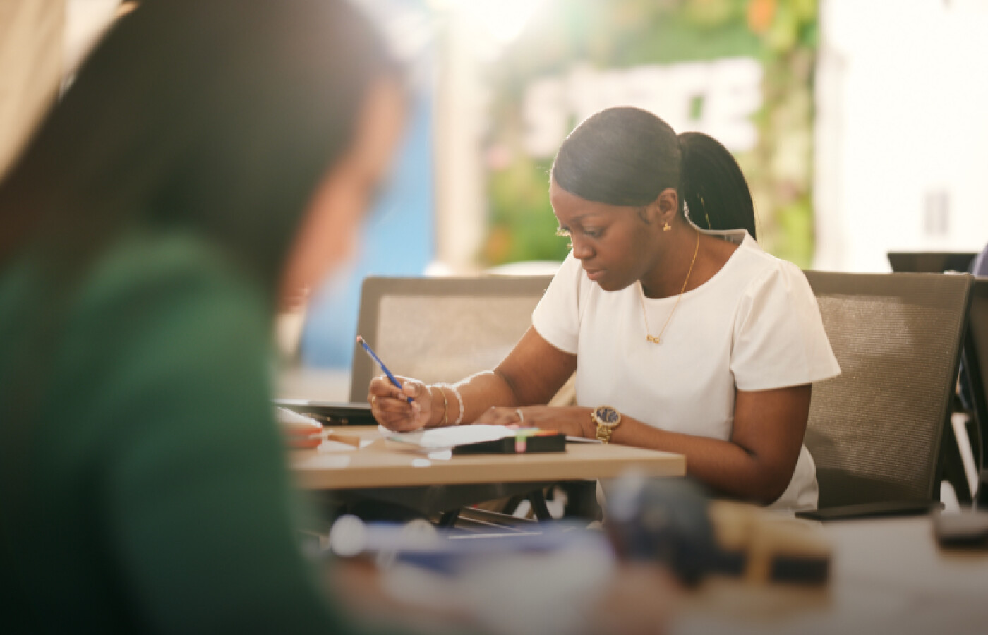 Female student working at a desk