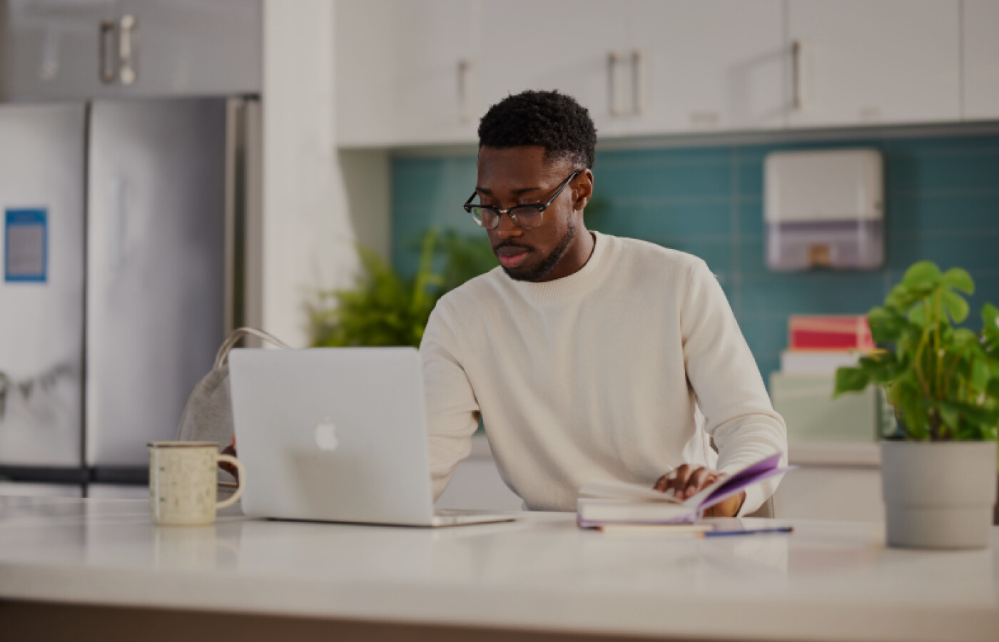 Graduate student working on a laptop at a desk