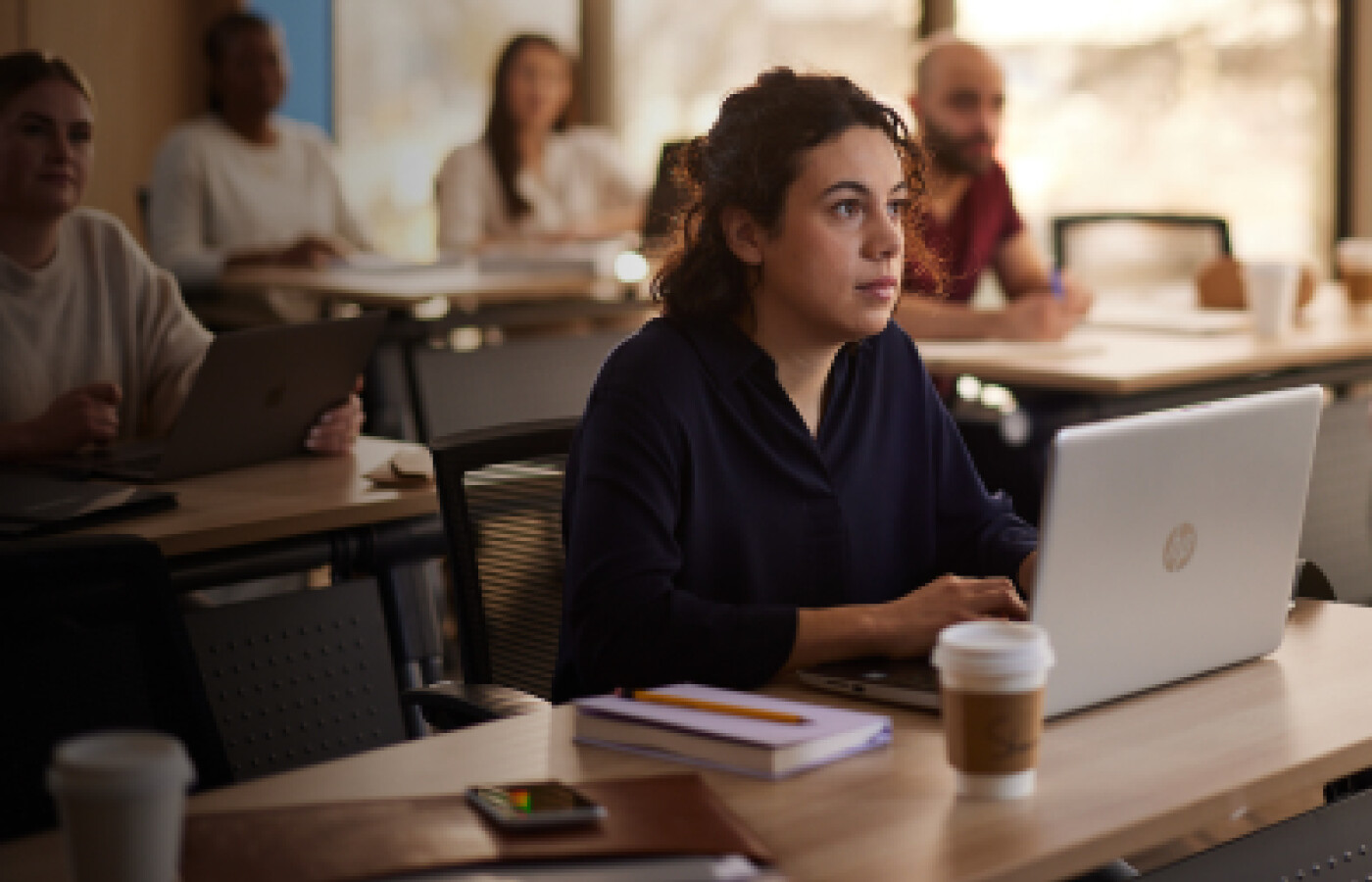 Student in classroom with laptop